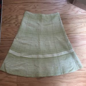 A-line skirt, embroidered. Cream and green.